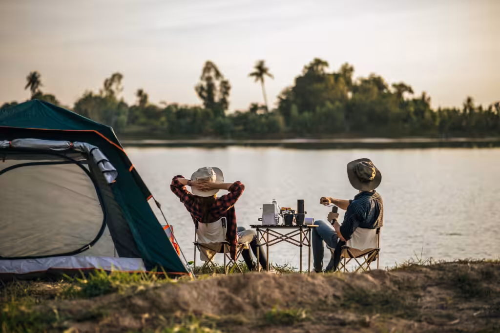 Cheerful Young Couples camping with morning coffee. camping summer